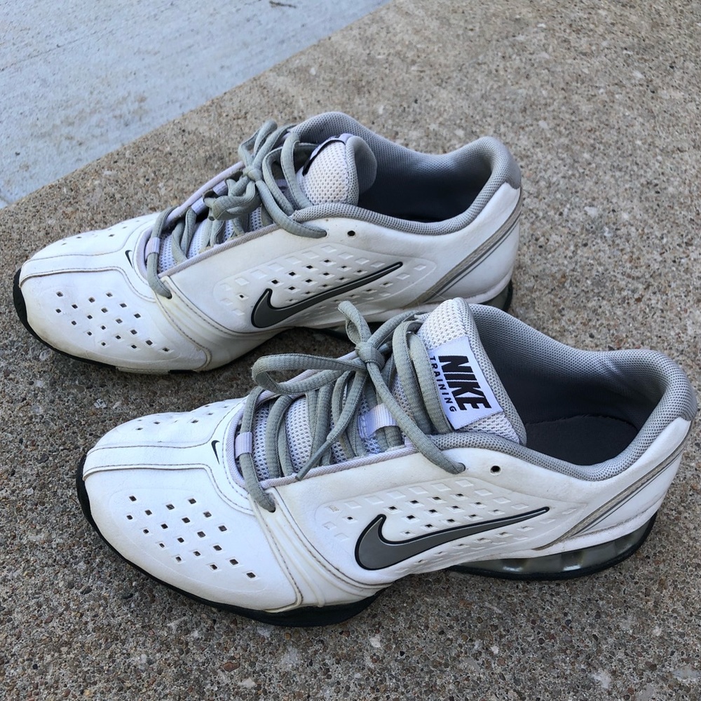 White and grey Nike tennis shoes